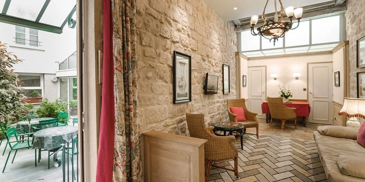 Lobby of the Duplex Suite and courtyard of the hotel La Perle Picture with the courtyard and the lobby of the Duplex Suite of the hotel La Perle in Paris