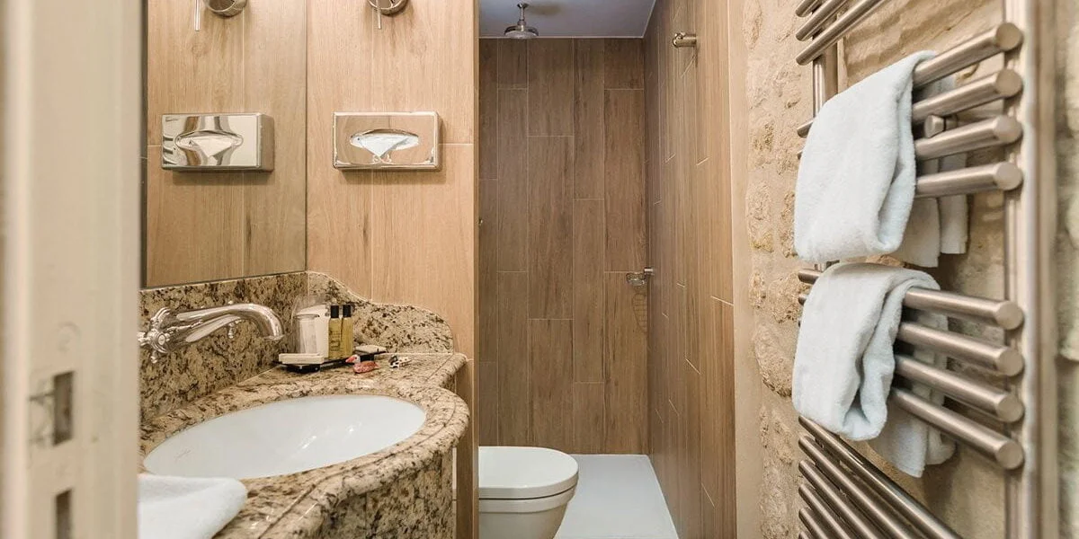 Downstairs bathroom of the Duplex Suite at La Perle Dowstairs bathroom with shower in the Duplex Suite of the hotel La Perle in Paris