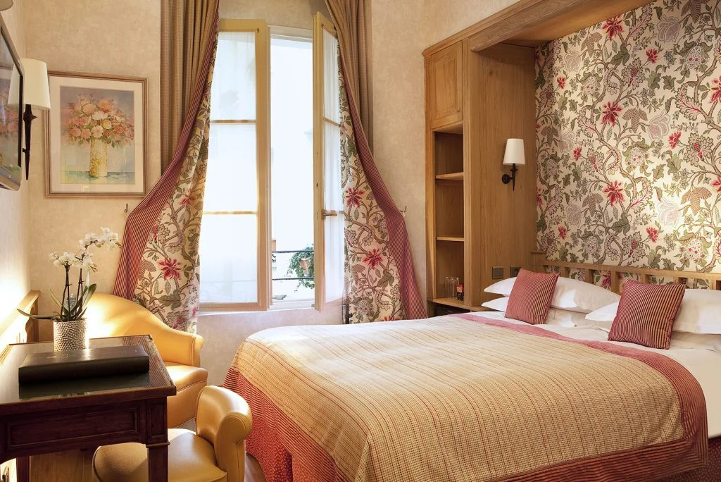 La Perle Hotel 5 Picture of a classic room with flowers fabric at the hotel La Perle in Paris